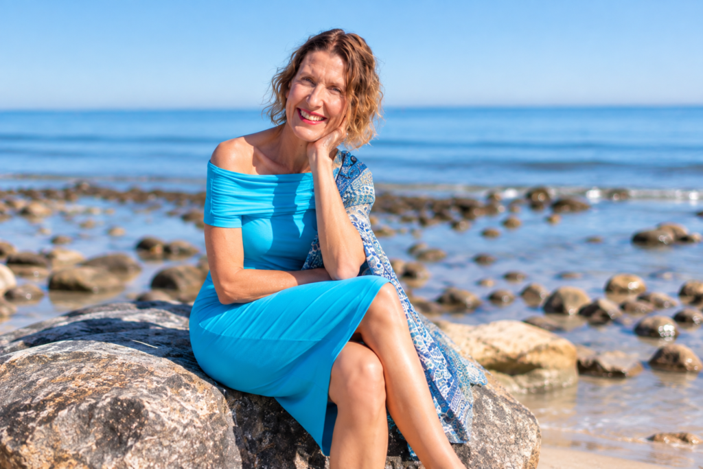 Kate Driver, The Midlife Health Detective, sitting by the beach in Adelaide